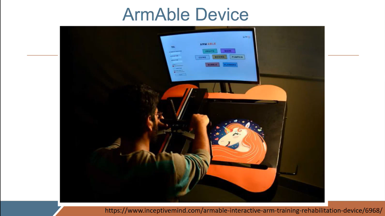 Person using the ArmAble device for interactive arm training rehabilitation. The setup includes a screen displaying therapy game options and an arm movement board with a colorful design, demonstrating technology-assisted physical therapy for stroke recovery.